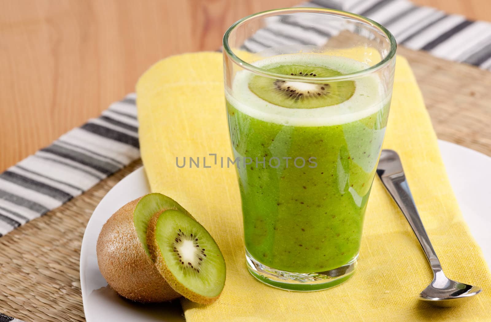 A tasty kiwi smoothie in a natural setting