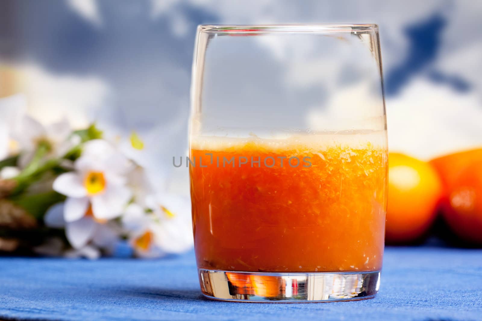 A fresh orange smoothie made with fresh fruit