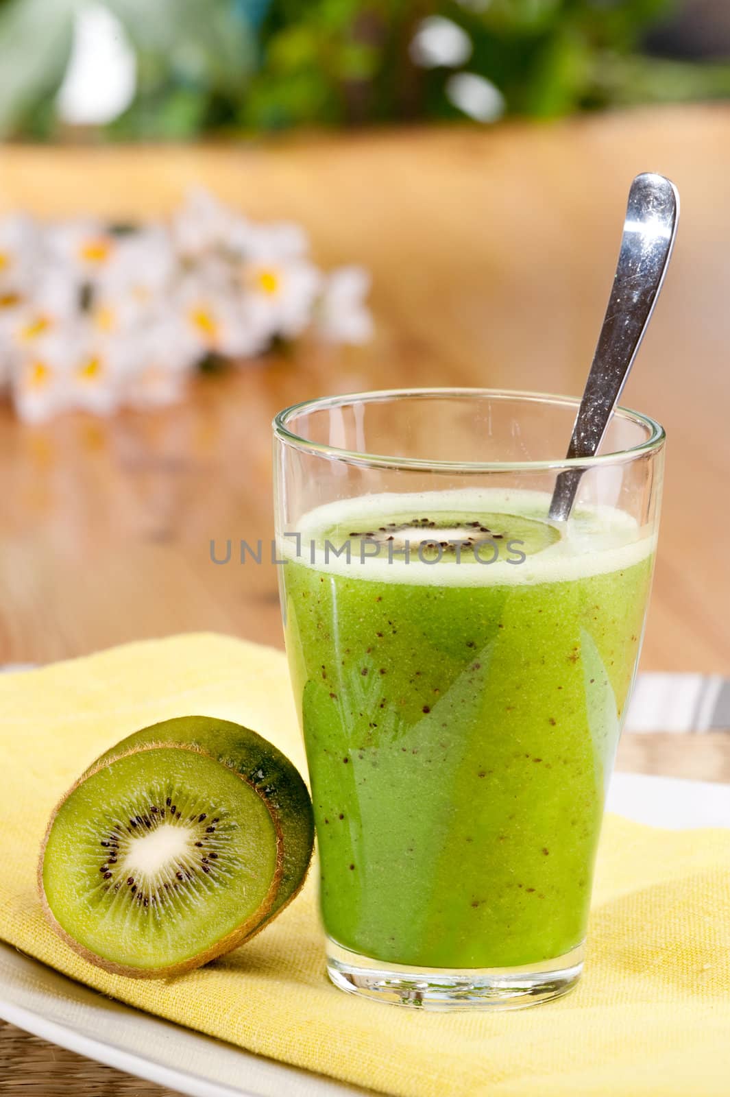 A tasty kiwi smoothie in a natural setting