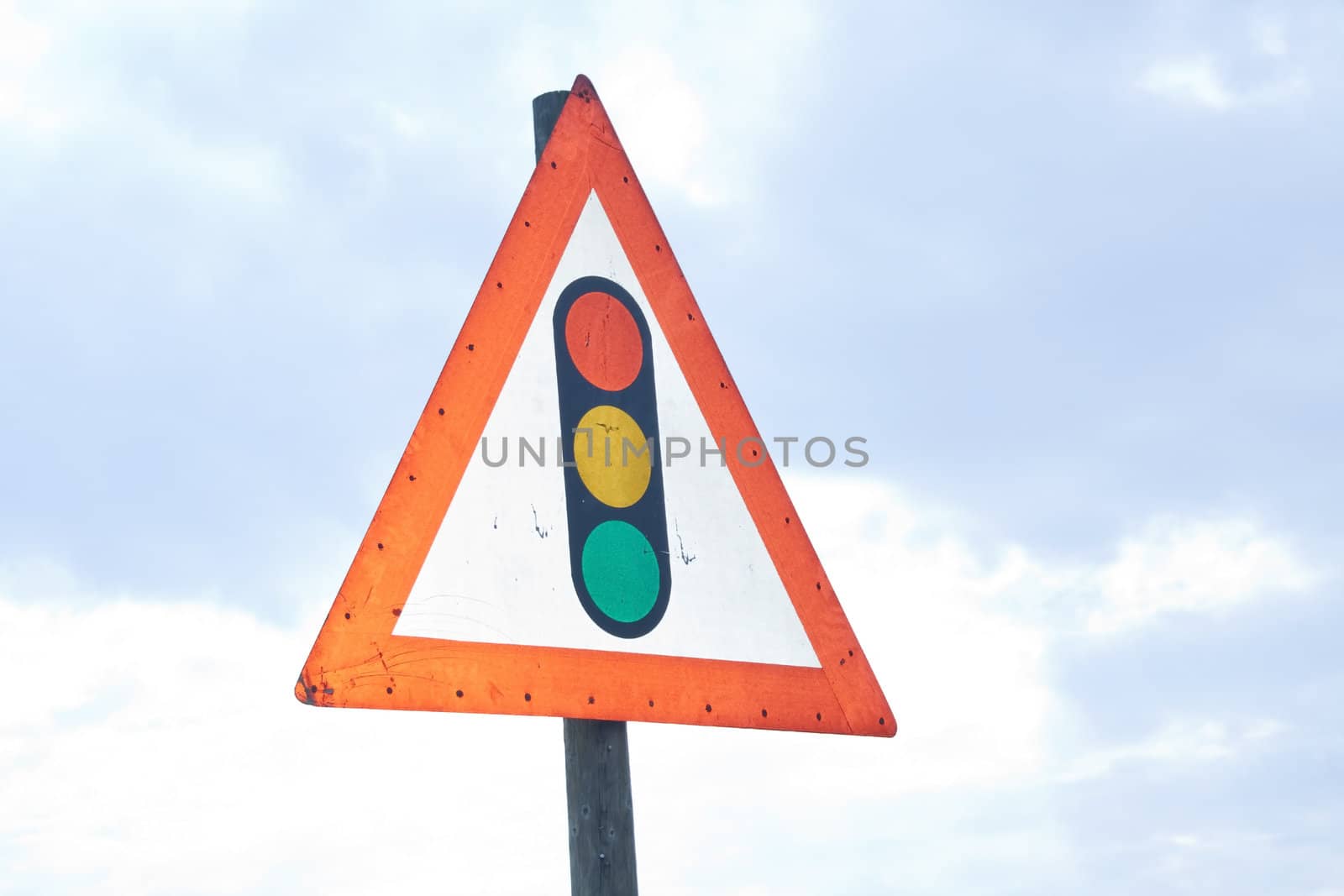 Caution sign with traffic lights