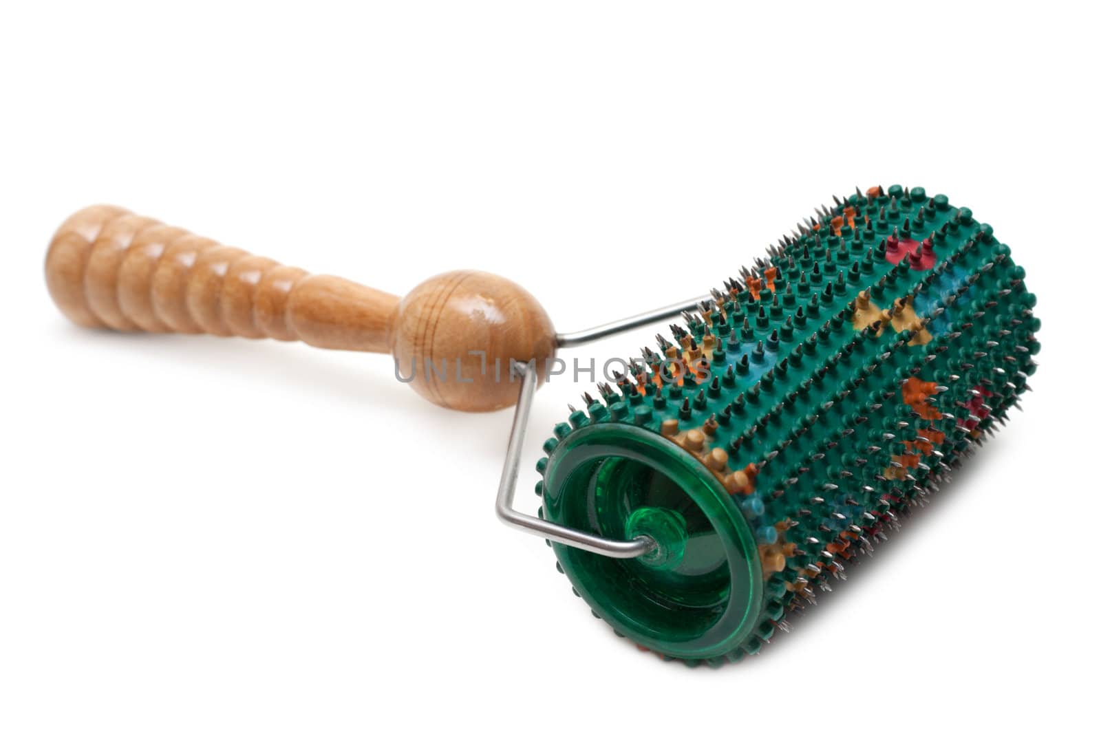 Cylindrical massager with needle and wooden handle on white background