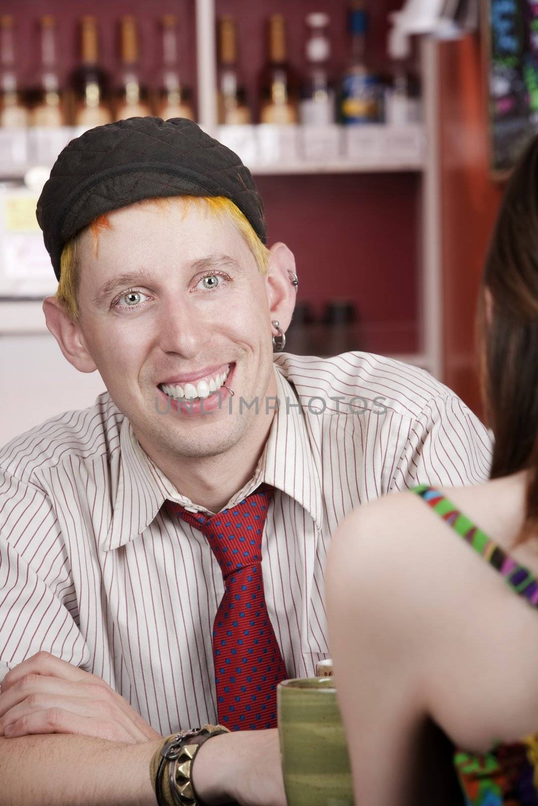 Trendy Young Man in Coffee House with Female Friend