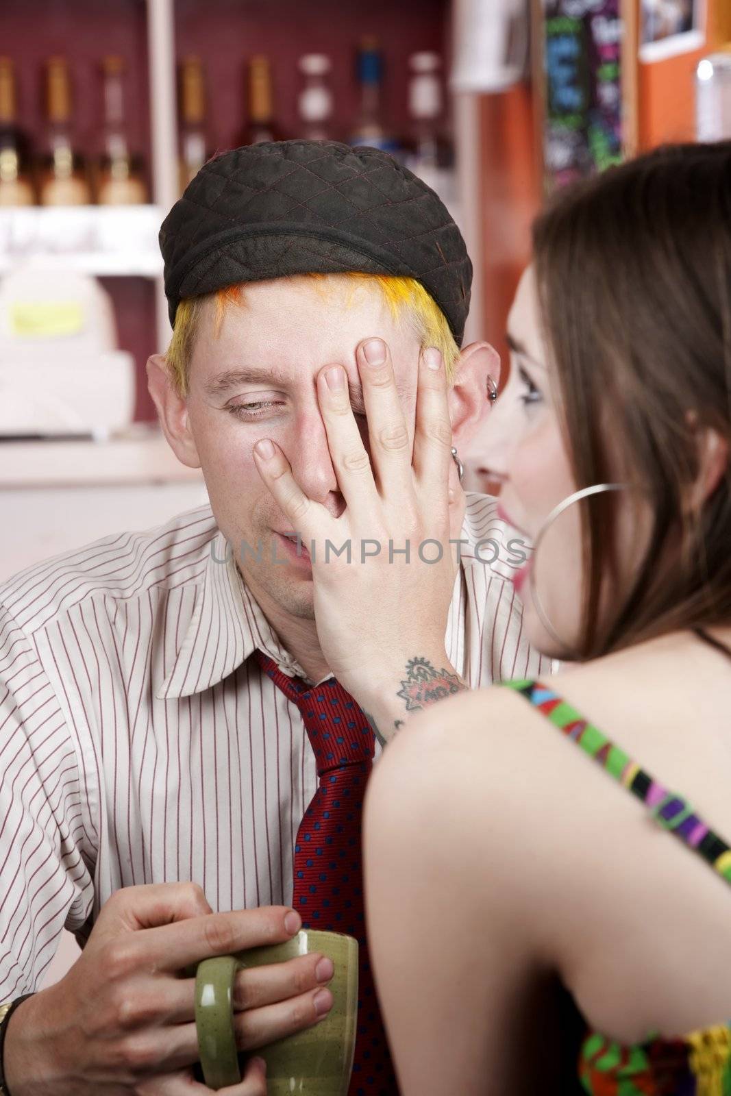 Young man making an exasperated expression gesture on a bad date