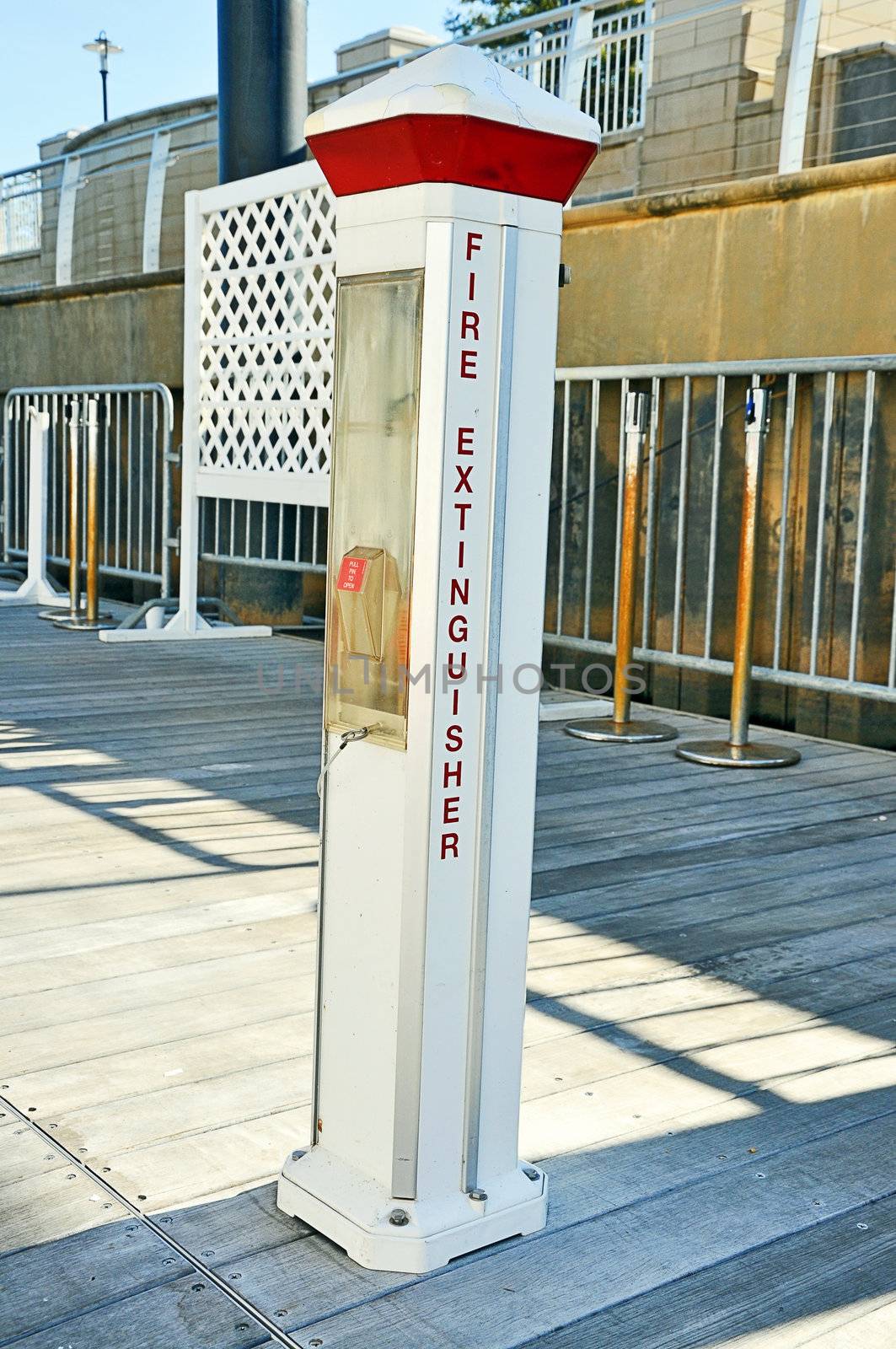 Fire extinguisher on boat dock.