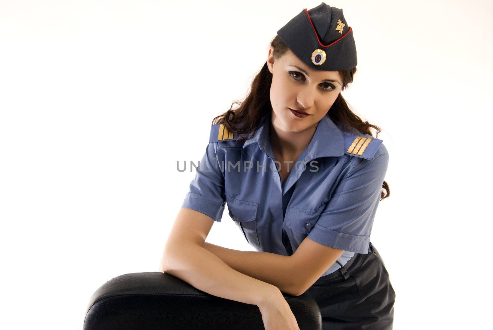 Young beautiful woman in police uniform posing