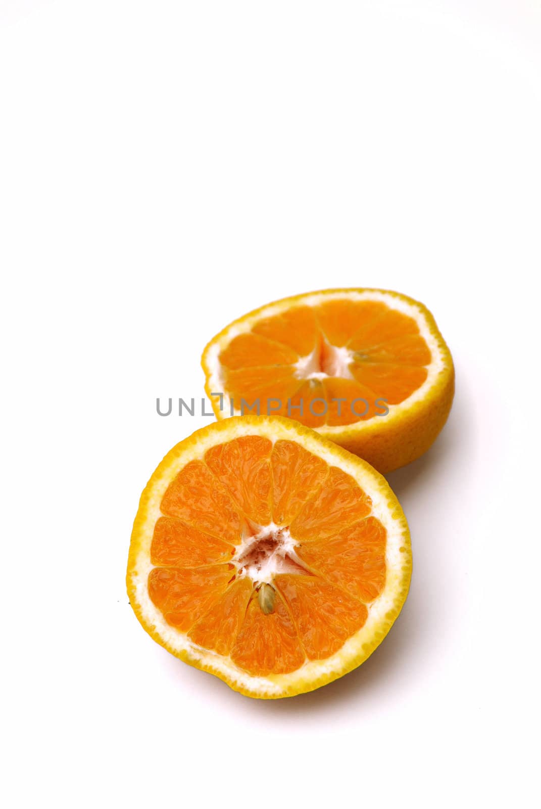 Orange fruit cut in half isolated on white background