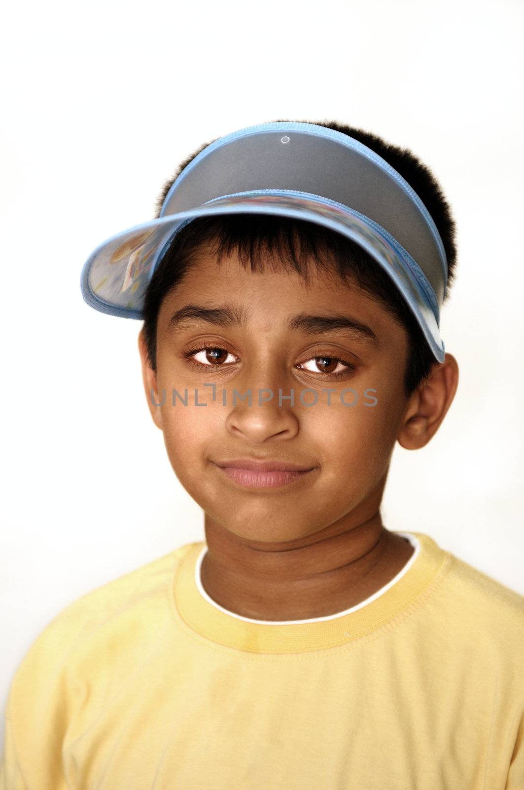 An handsome Indian kid smiling on the screen