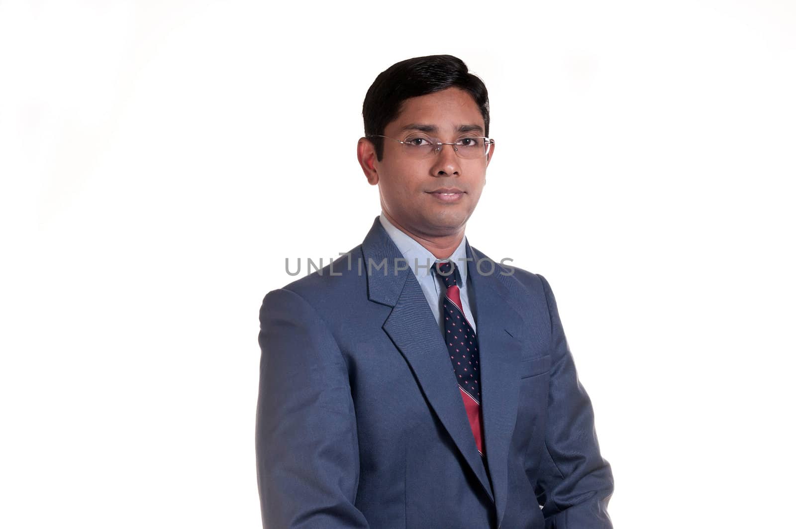 An handsome Indian businessman smiling successfully