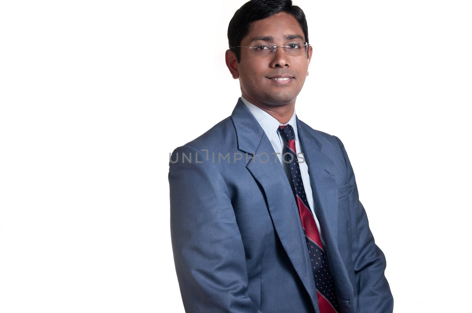 An handsome Indian businessman smiling successfully