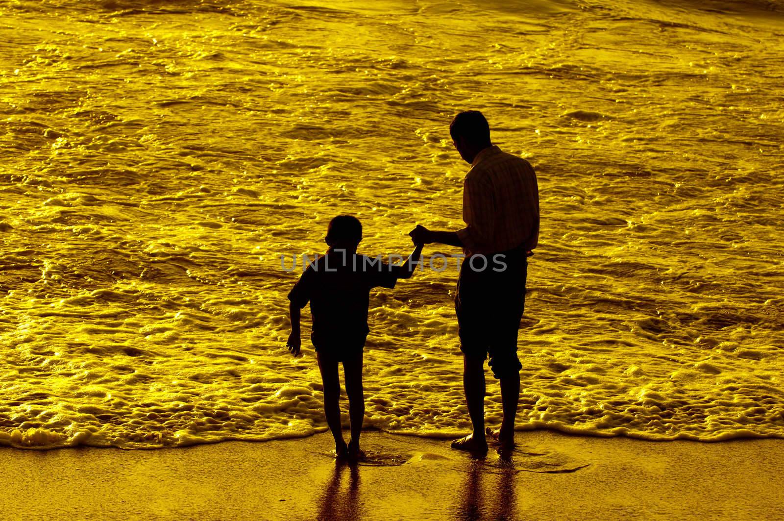 Father and son having intimacy at a local beach