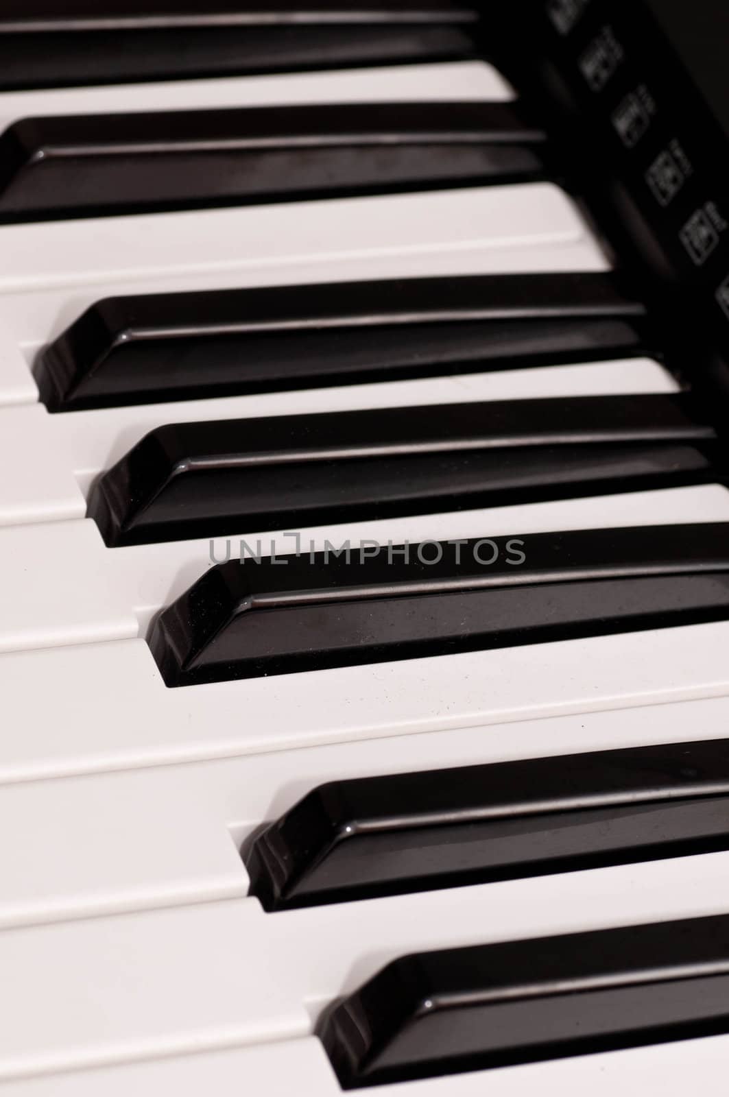 close up shot of black and white keys of a piano