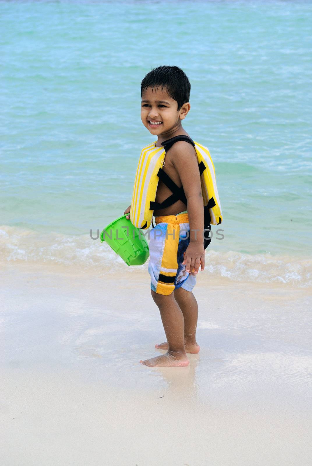 An handsome Indian kid enjoying at the beach