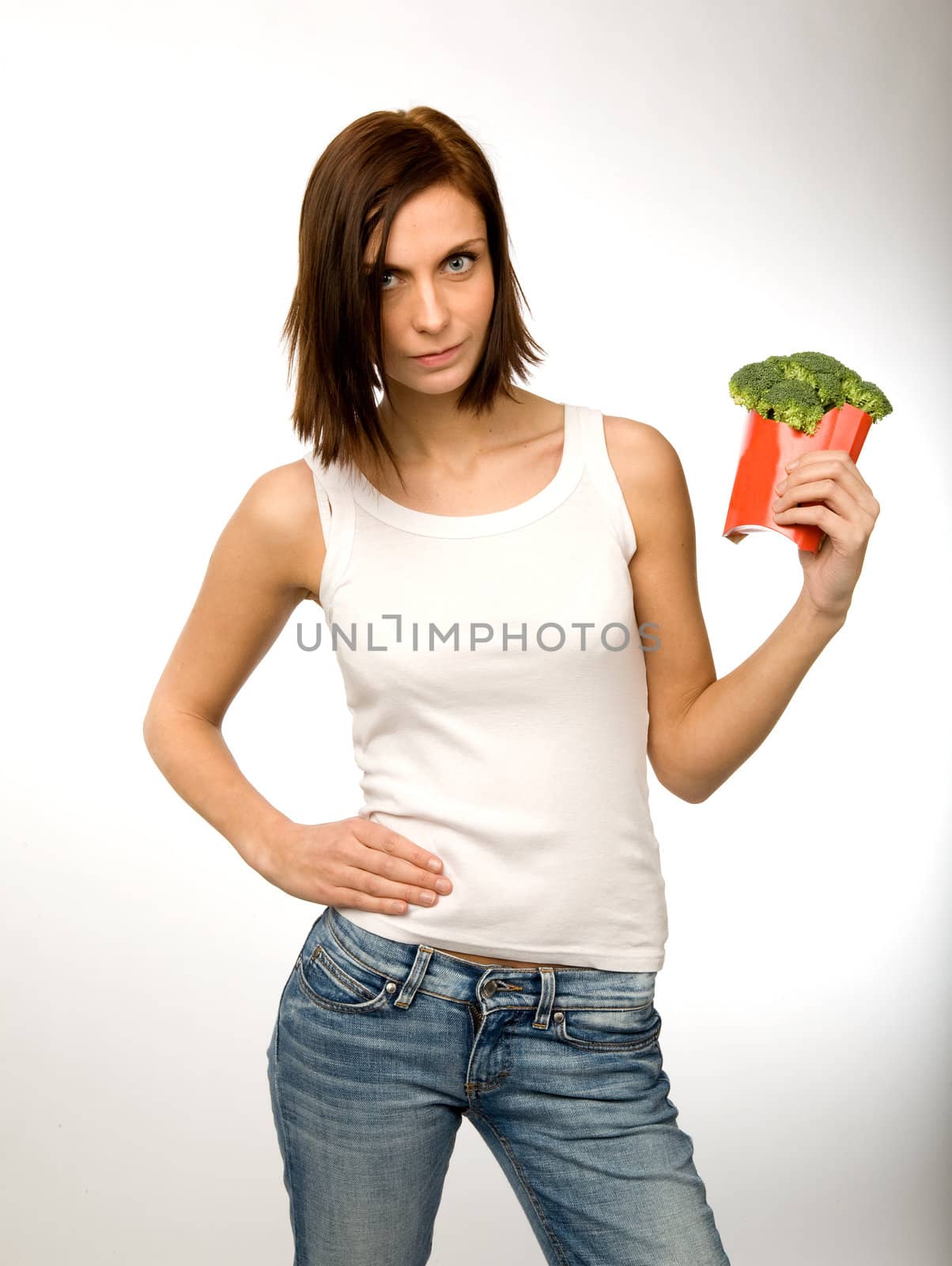 A woman holding a fast food container with a snack of vegetables