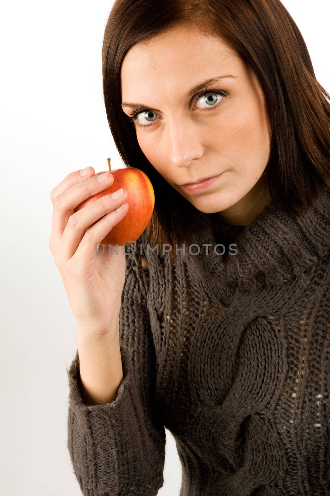 A female eating an apple