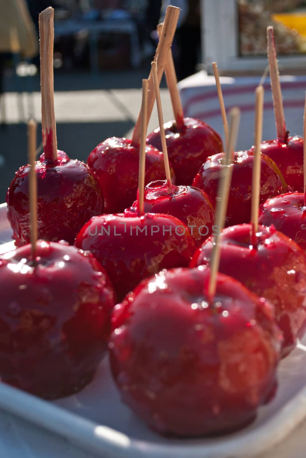 Red, sweet candy apples with wooden sticks