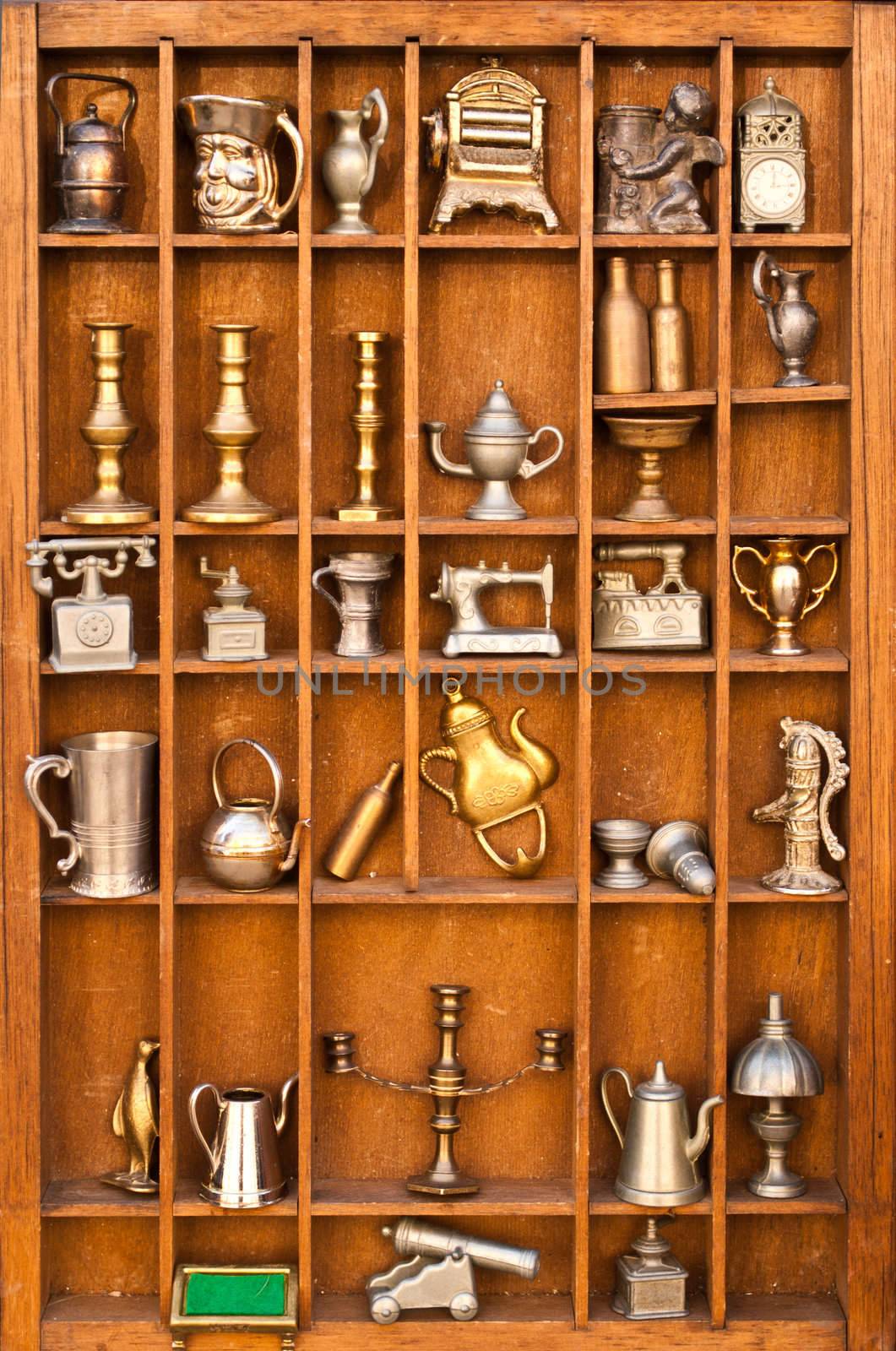 Antiques shelf in portrait mode by robertblaga