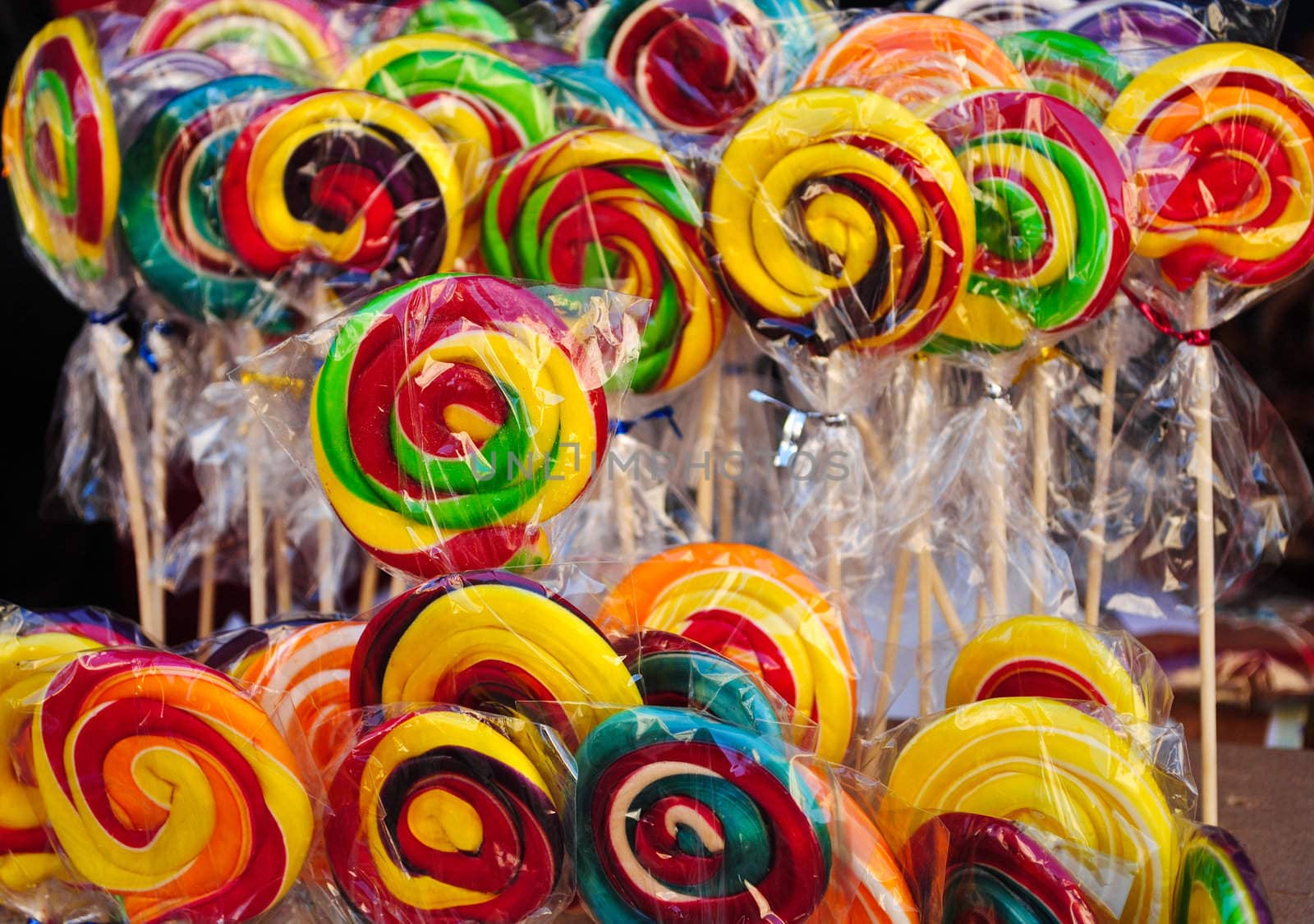 Many colourful lollipops, with yellow, red and green