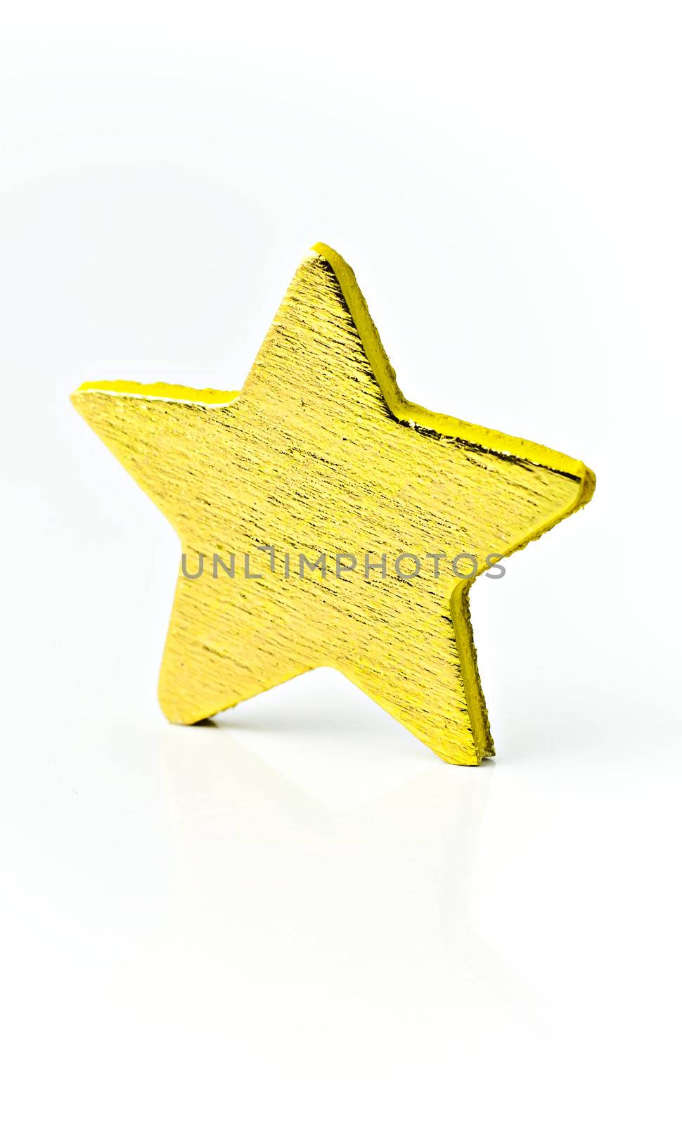 Isolated on white background a bright golden star.
