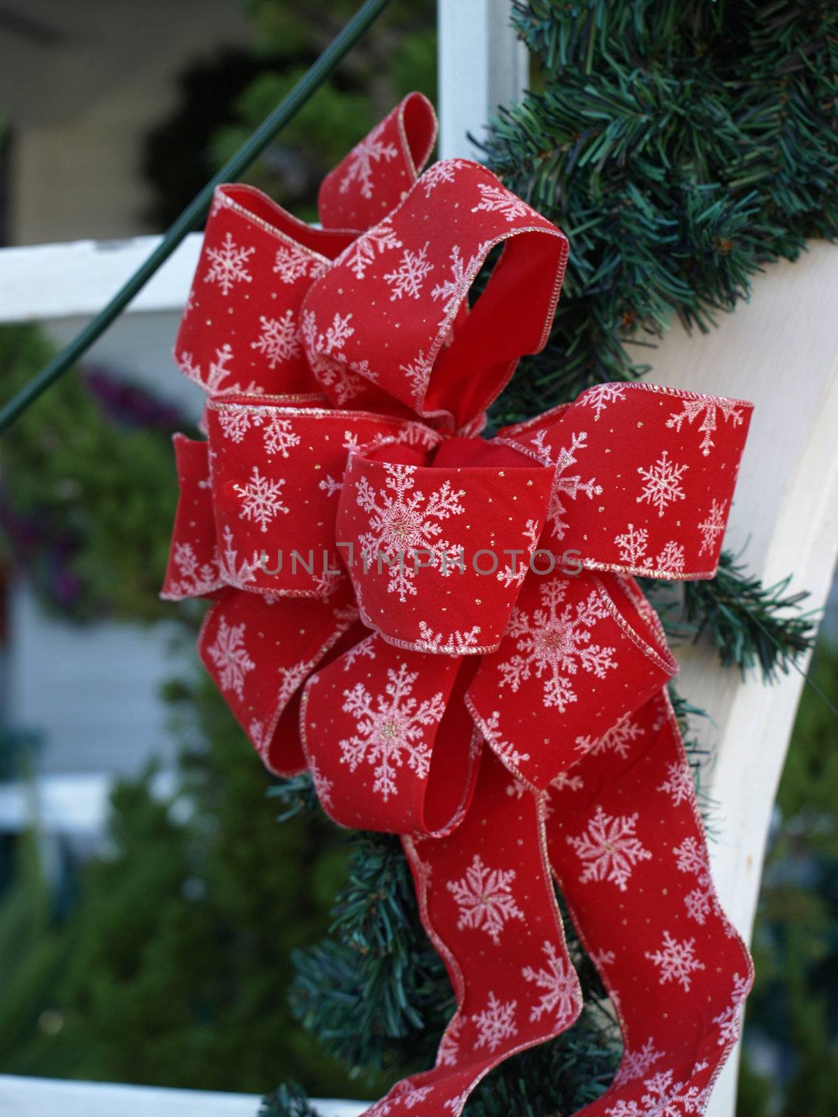 Christmas ribbon on a doorwat to decorate the season,