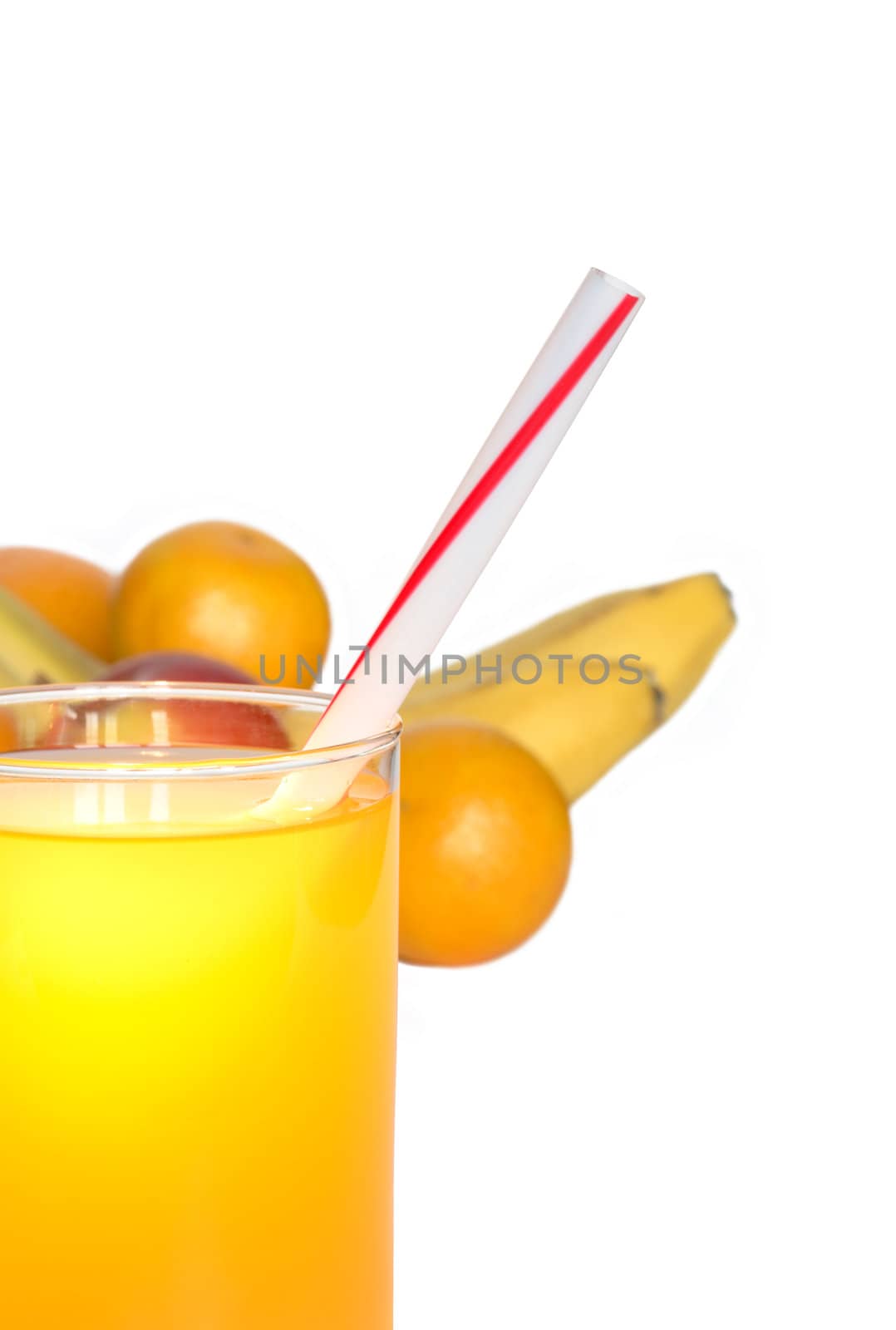 Glass of juice closeup on white background with various fruits