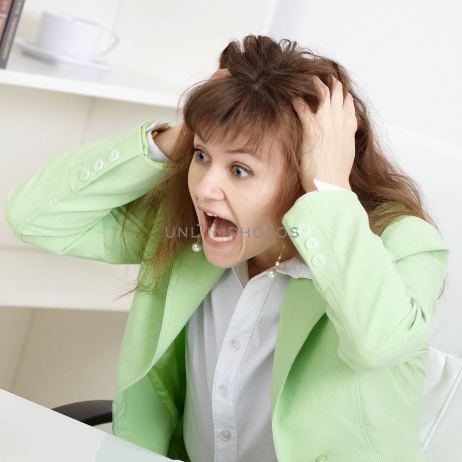Strongly frightened young business woman loudly shouts