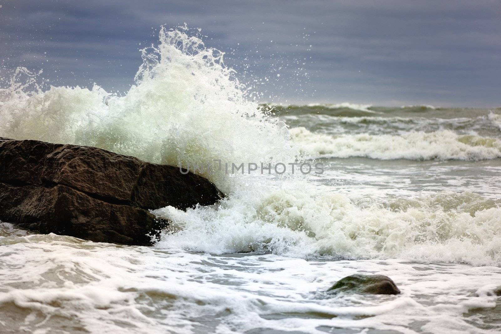 Foamy waves from a storm near the sea cliffs