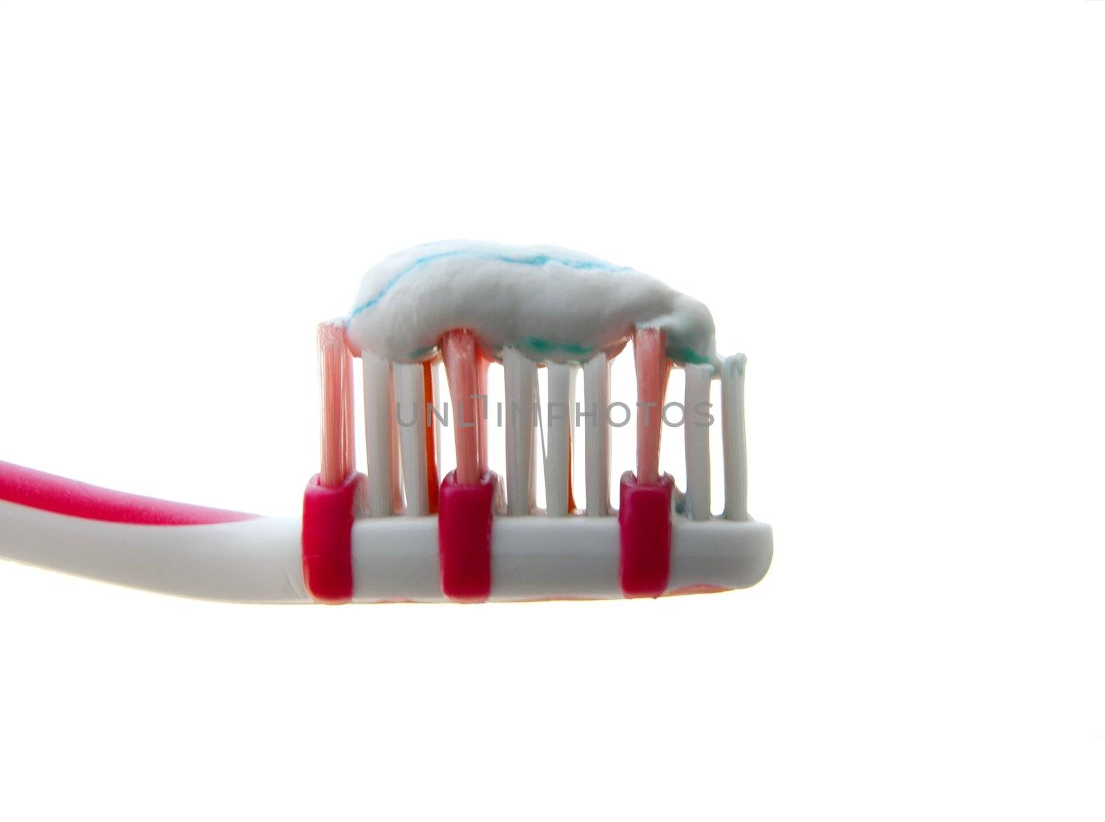 Closeup of a toothbrush with toothpaste on it