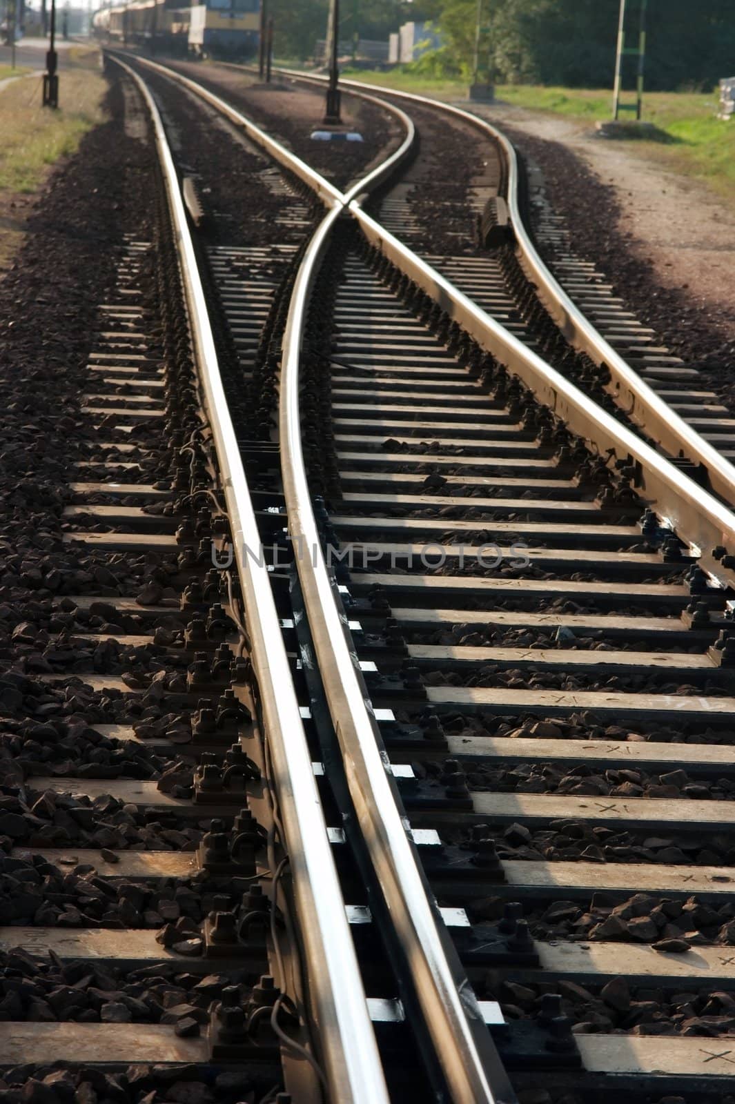 Railway junction with a coming train in the background