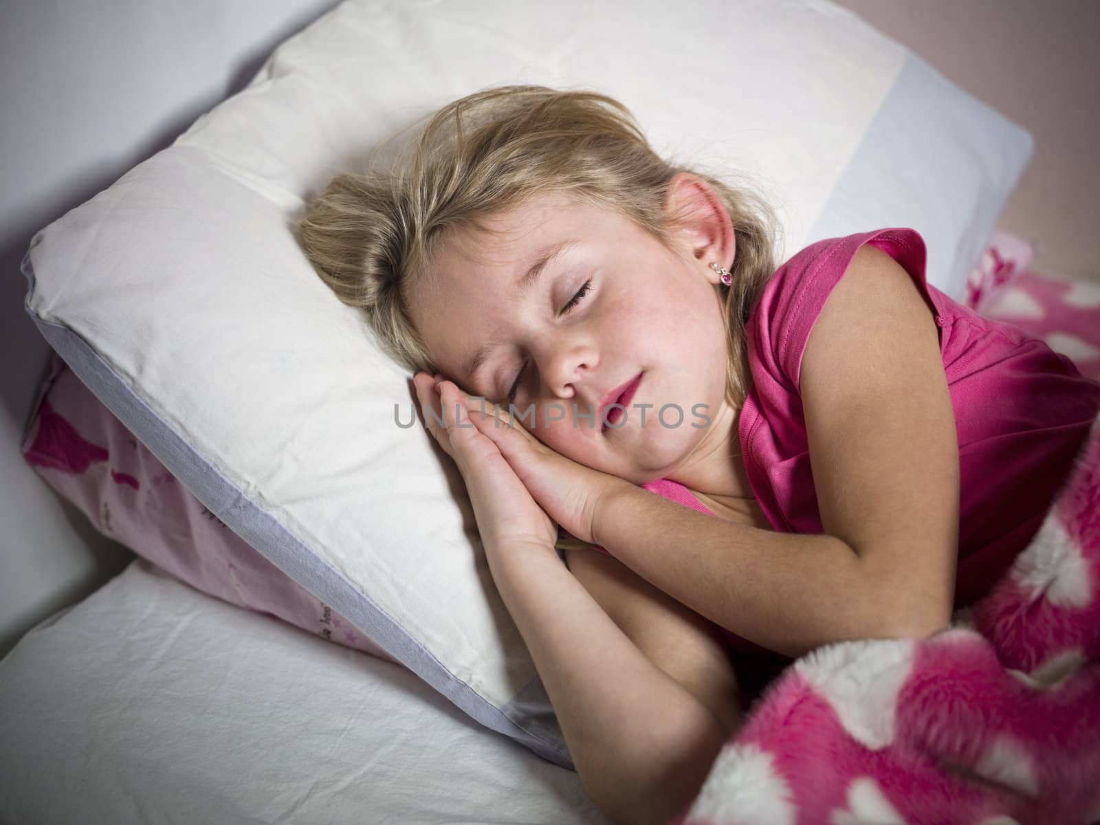 Young Girl sleeps in her bed