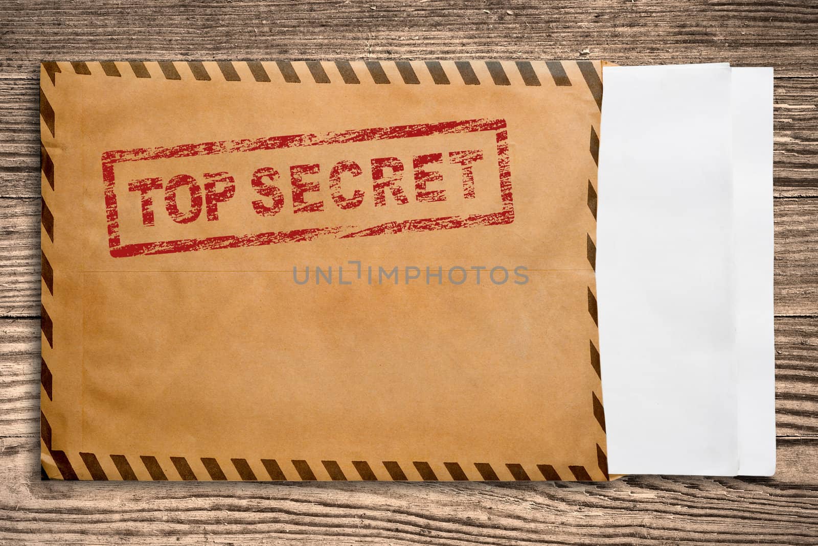 Open yellow envelope with top secret stamp and blank papers, on wooden table, clipping path. 