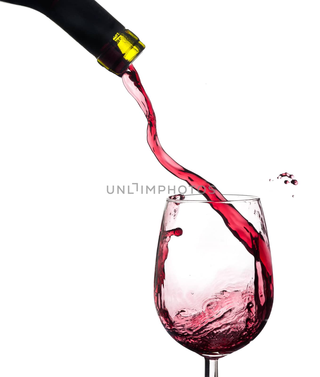 Red wine splash on a glass, white background.