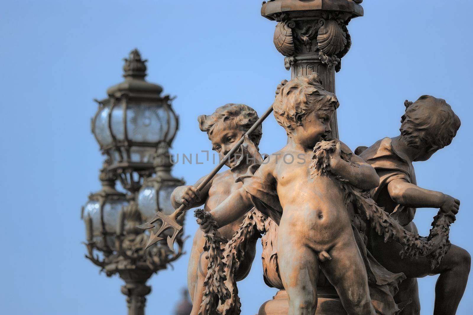Bridge Alexandre III. Sculpture and lamppost. Photo with tilt-shift effect