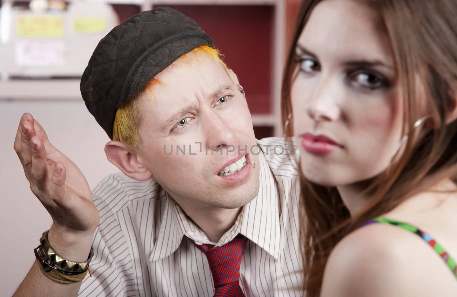 Young man confused by disagreement with pretty woman