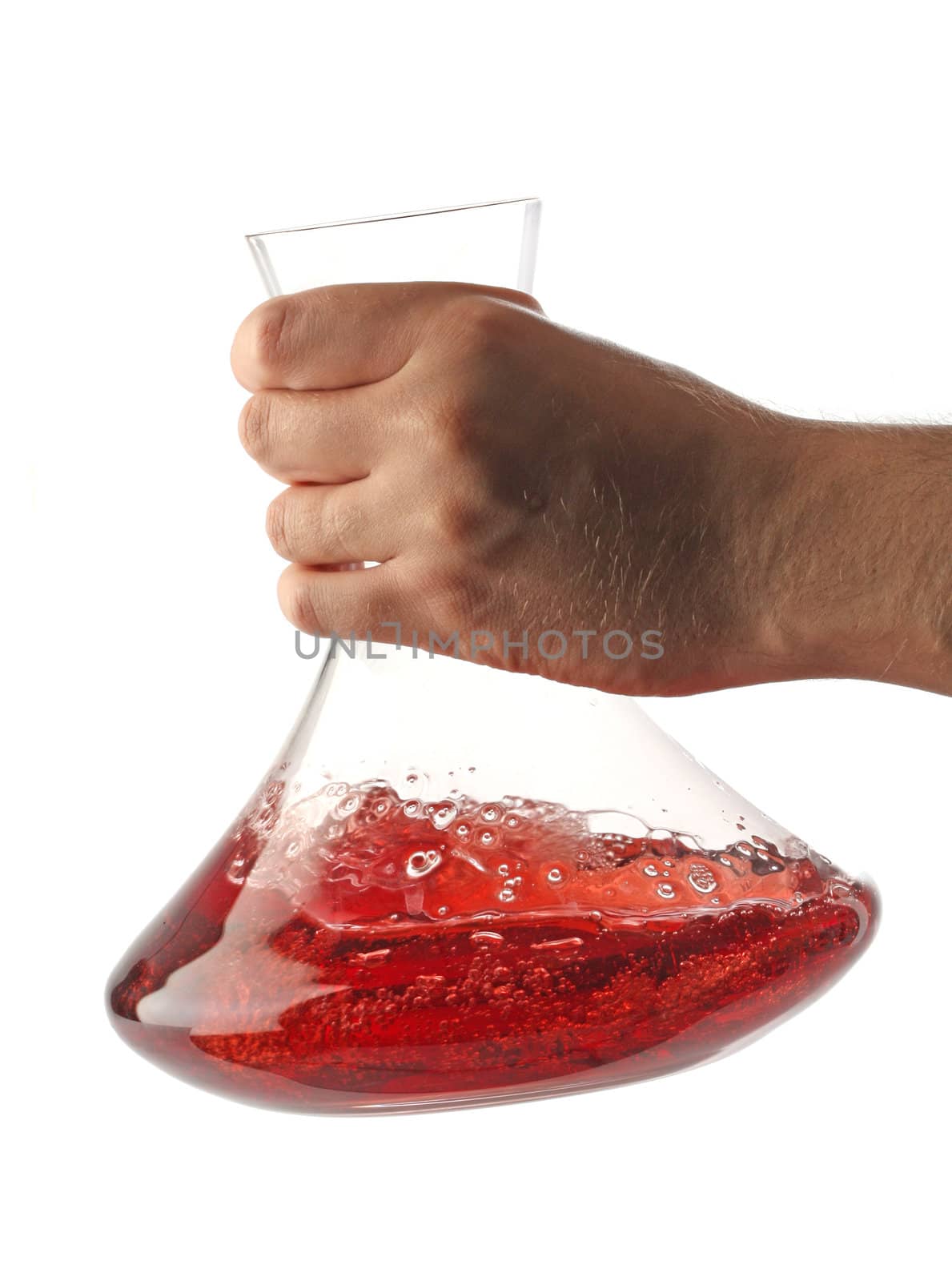 Hand shaking red wine with a decanter, isolated on white