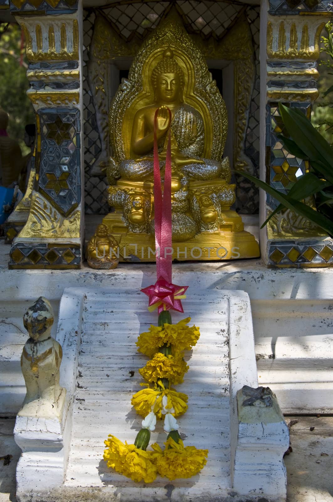 small golden statue of Buddha in Thailand