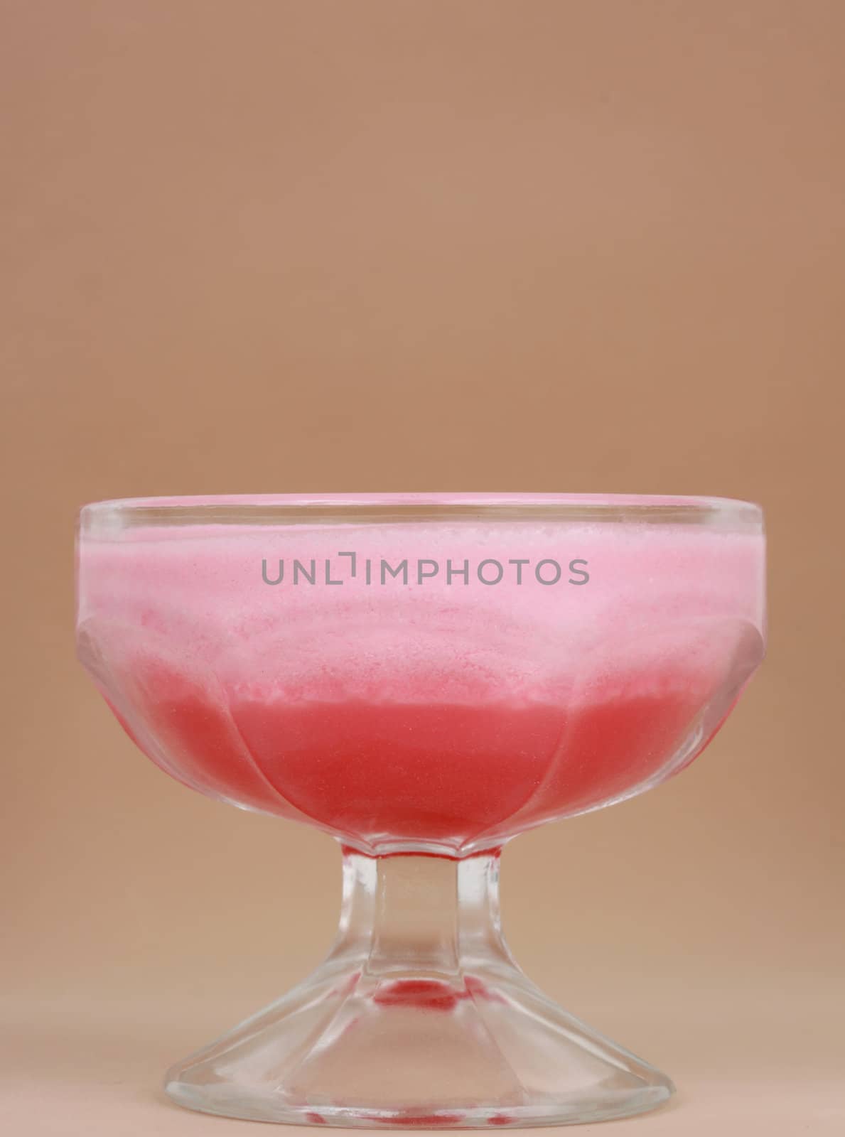 pink jelly and mousse dessert, beige background