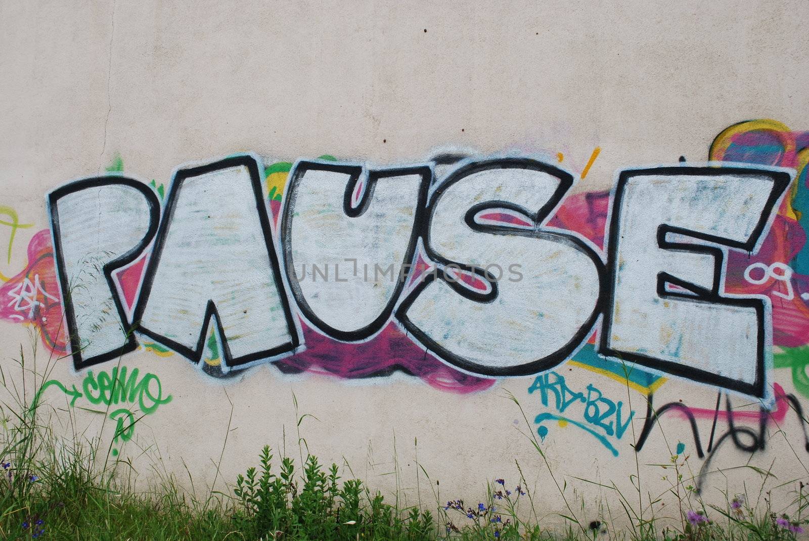 photo of a graffiti on a abandoned city wall