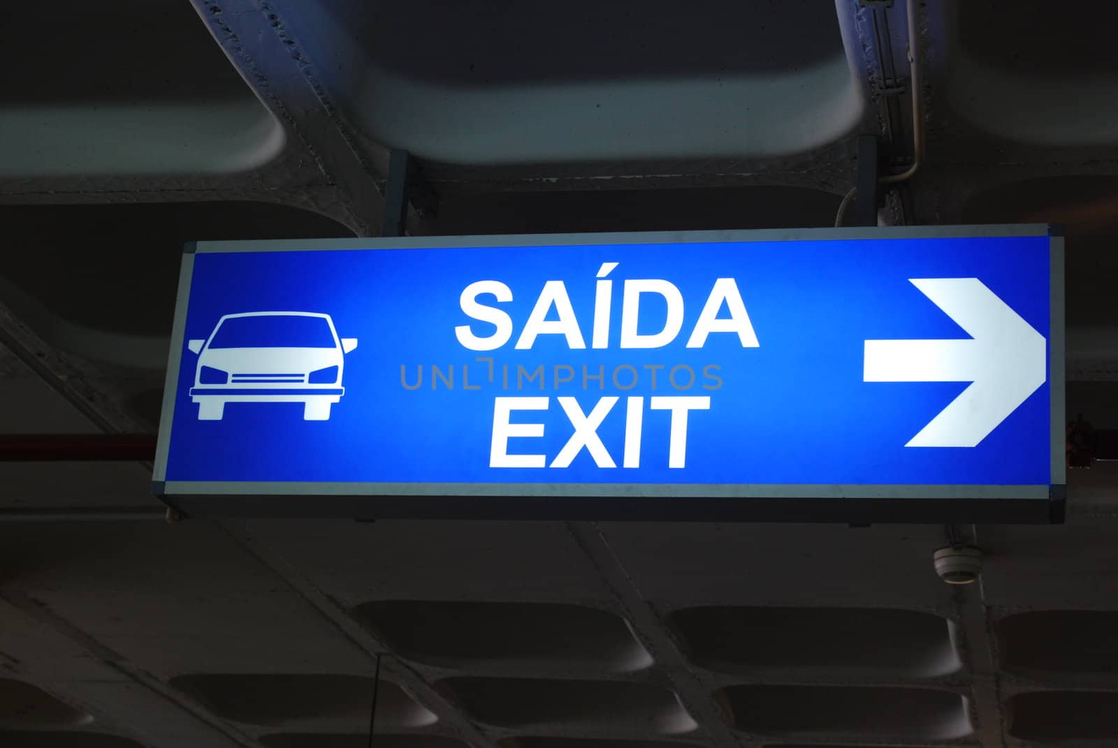 yellow exit sign at a international airport