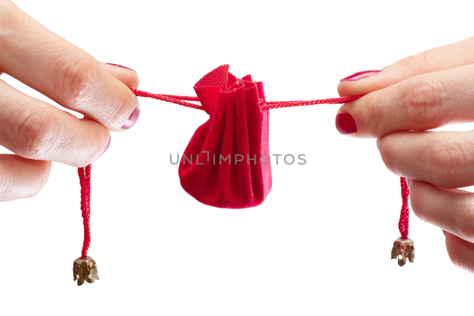 Woman stretching ribbons of gift wrapping 