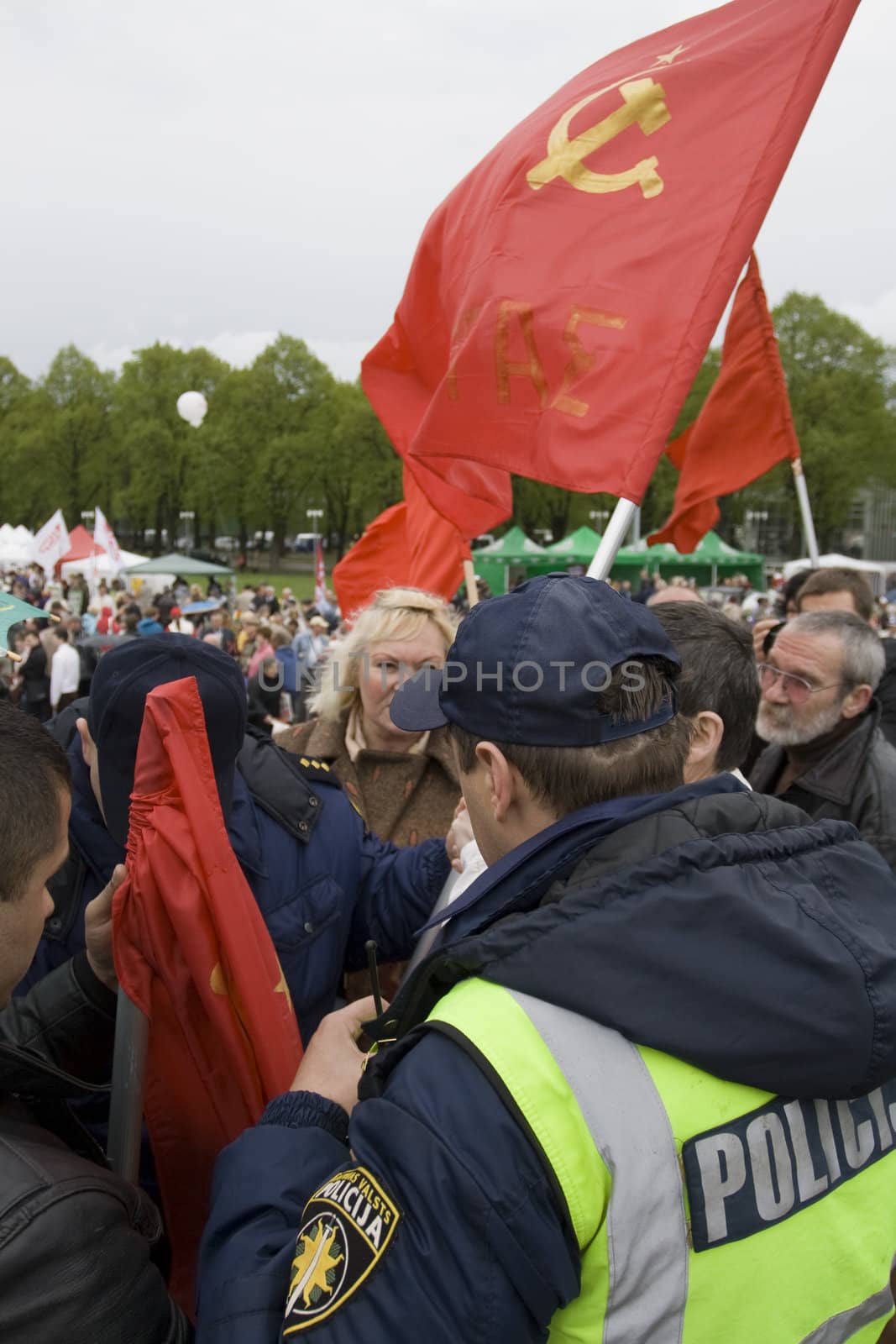 RIGA, LATVIA, MAY 9, 2009: The Police preclude to use the forbidden symbols of Soviet Union at Celebration of May 9 Victory Day (Eastern Europe) in Riga at Victory Memorial to Soviet Army