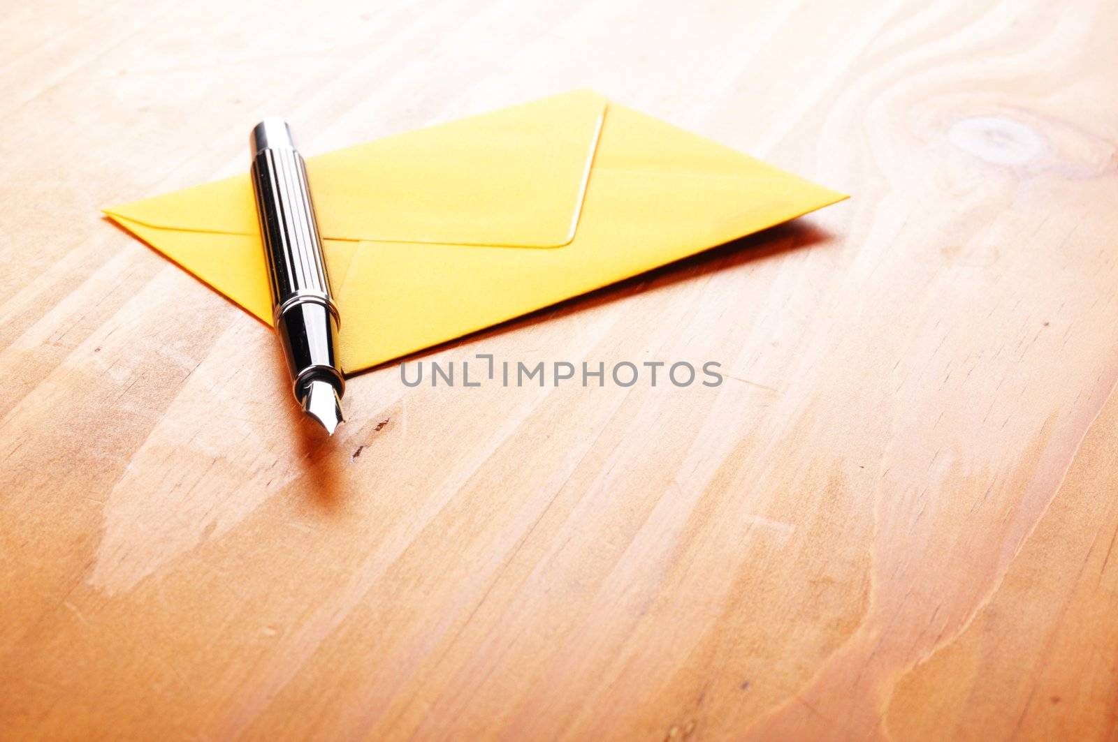 mail or email concept with envelope and pen