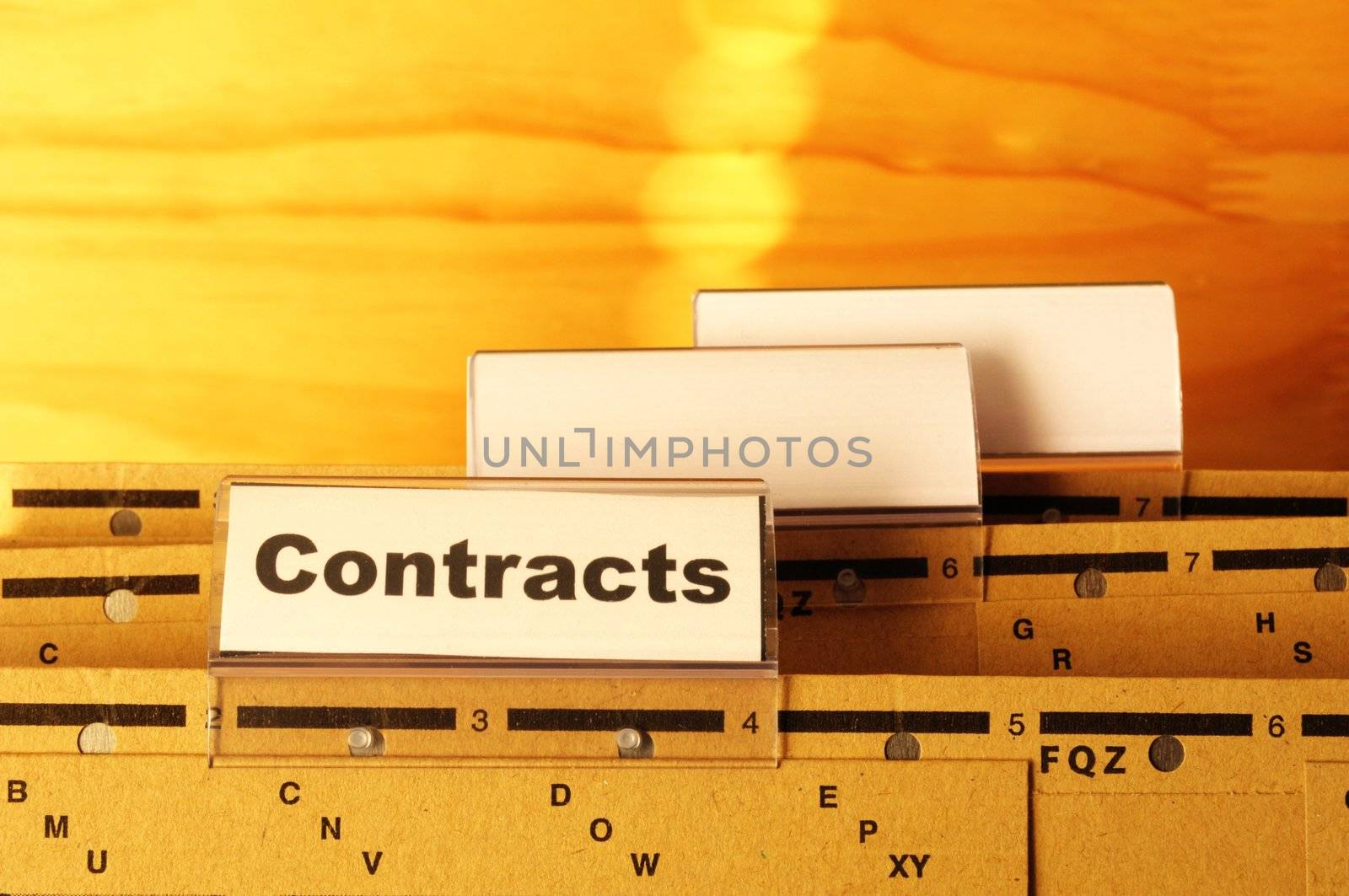 contract word on business folder showing trade or financial concept