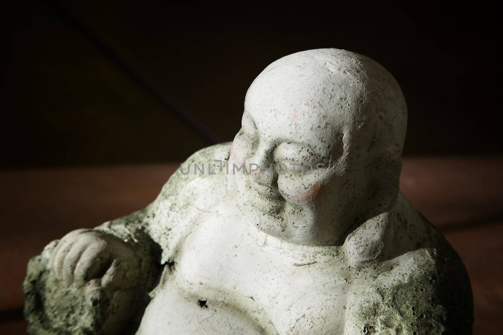 Concrete Buddha Statue in bright Afternoon Light