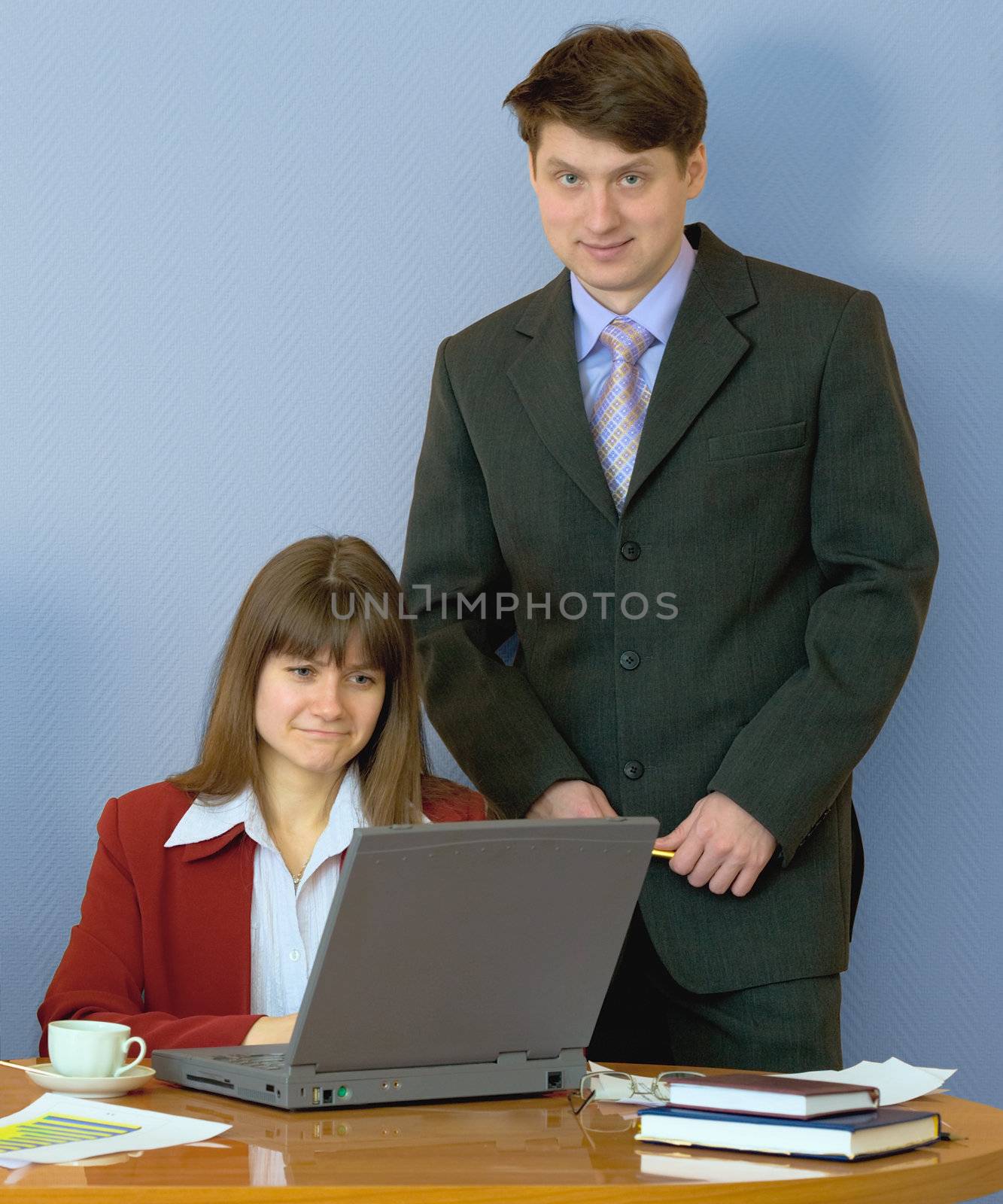 Girl sitting at a desktop and their chief