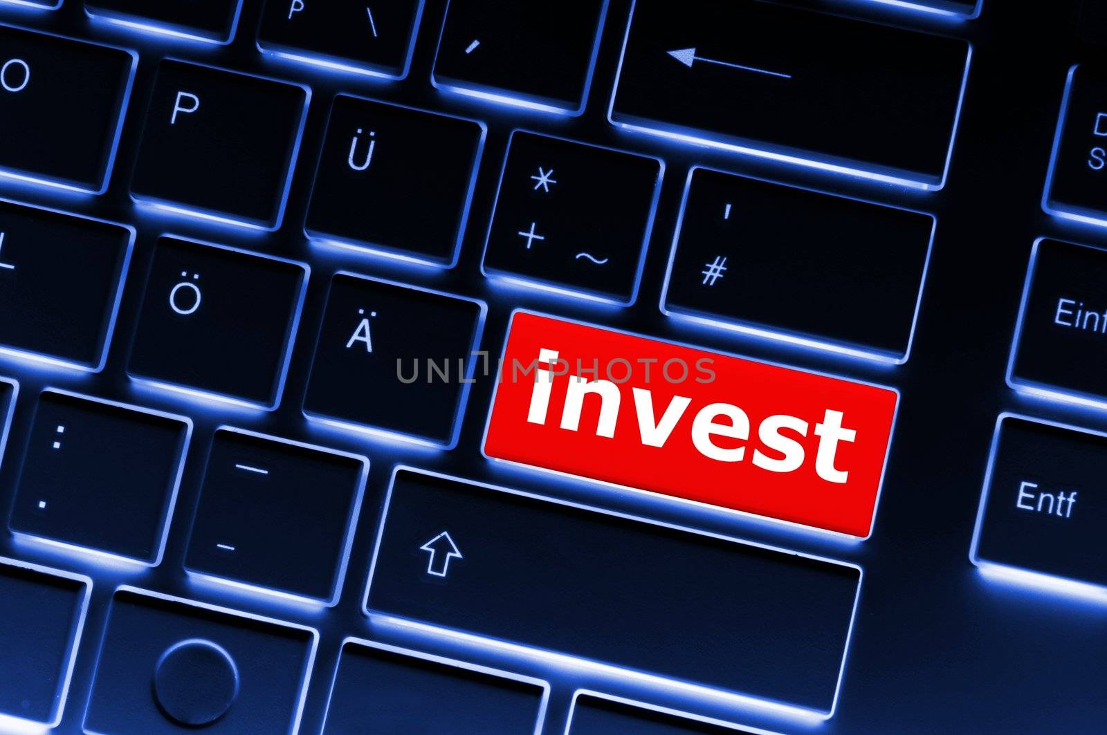invest or investment key or button in red showing business success