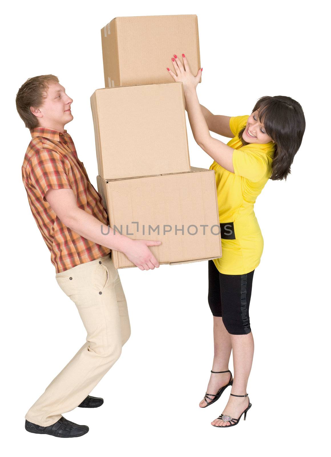 Girl loads the young man with cardboard boxes