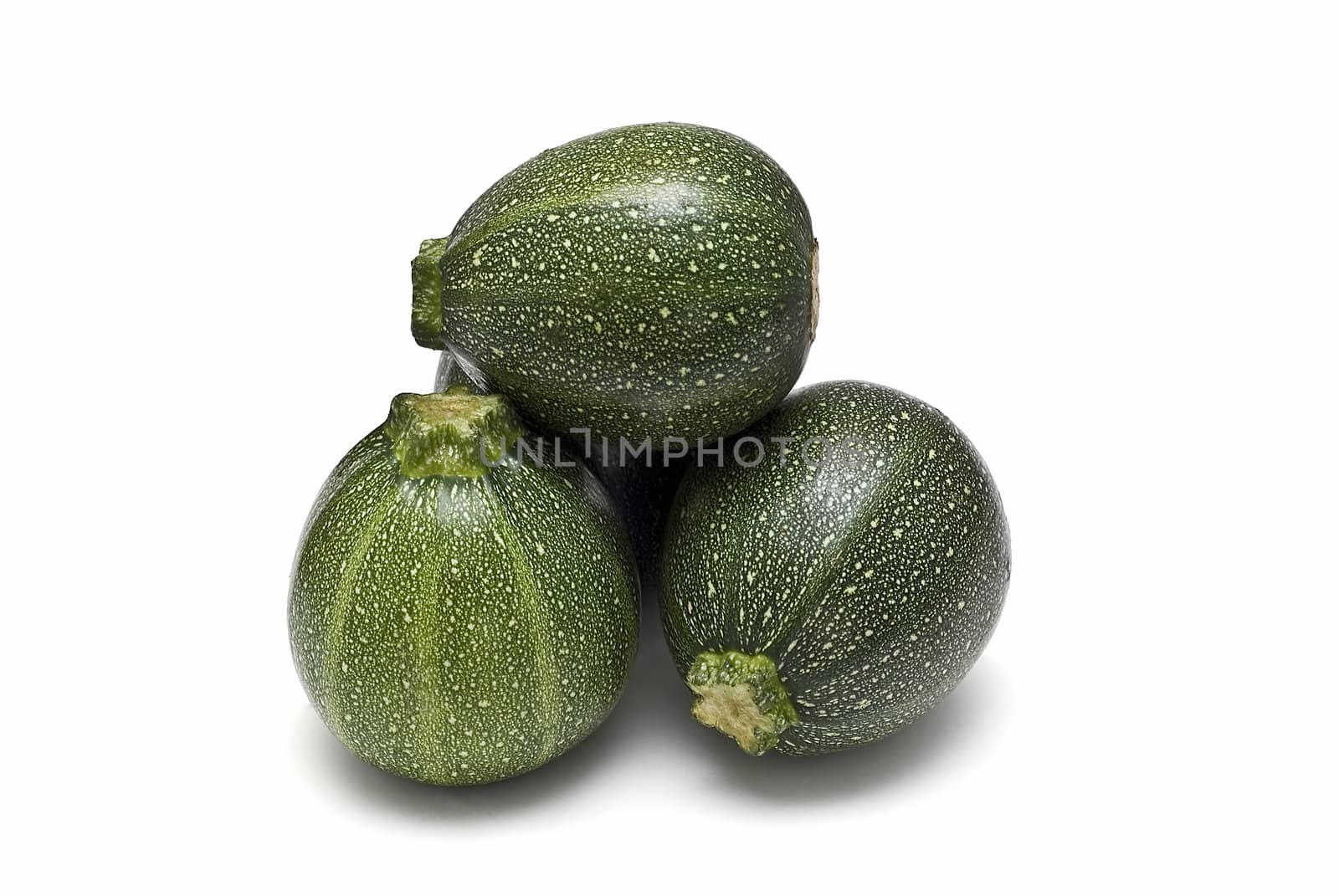 Round zucchini isolated on a white background.