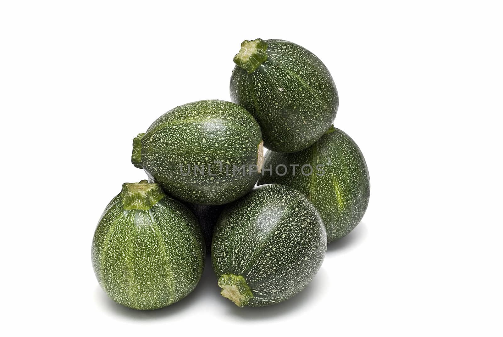 Round zucchini isolated on a white background.