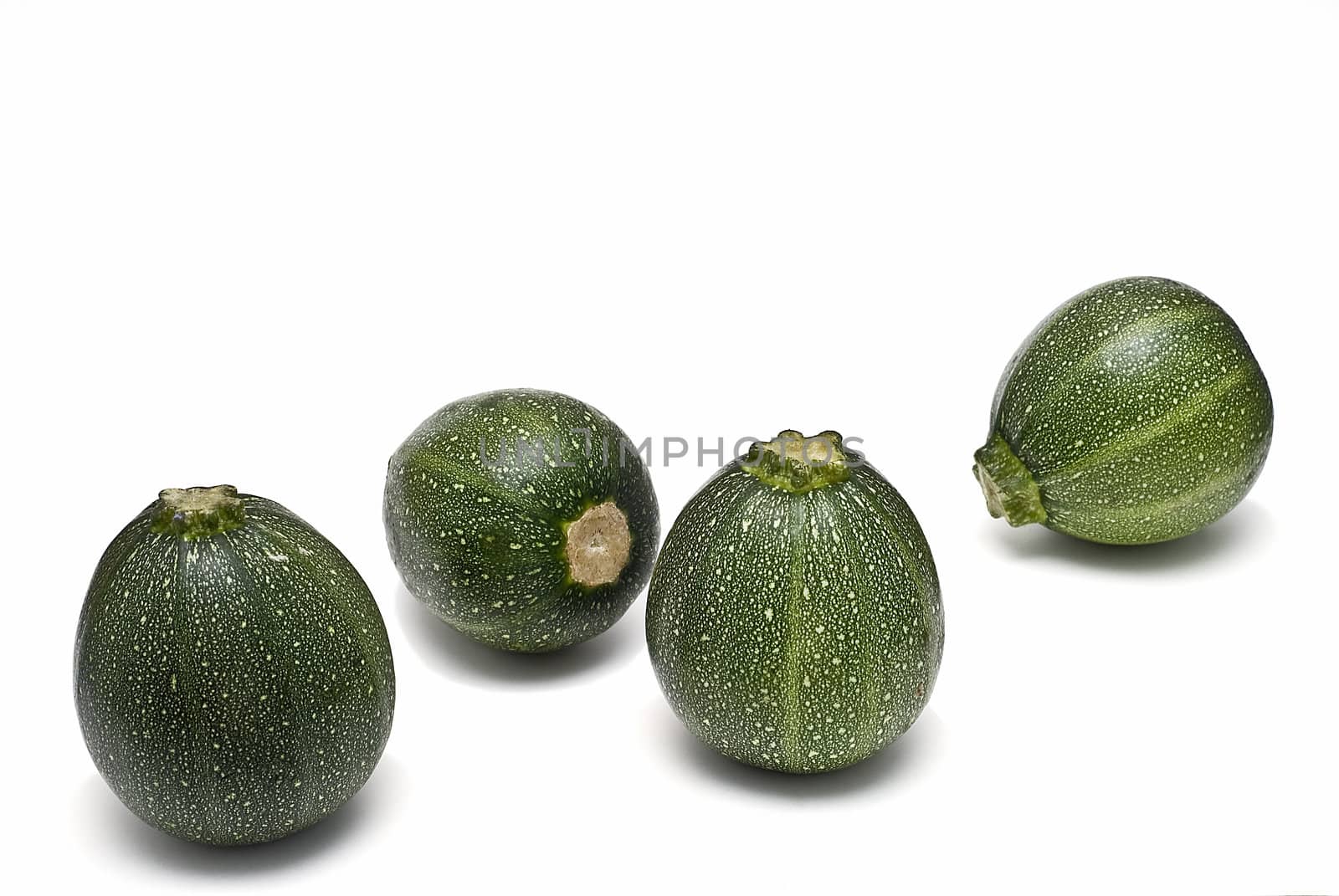 Round zucchini isolated on a white background.