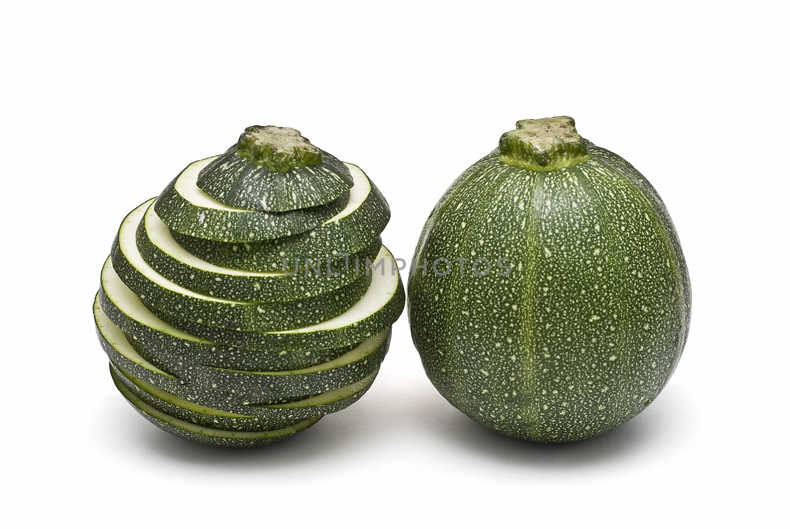 Round zucchini isolated on a white background.